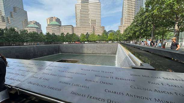 9/11 Memorial reflecting pool with victims' names engraved on the edge, Manhattan, New York City