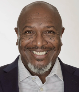 Mark Fowler smiling in a professional headshot